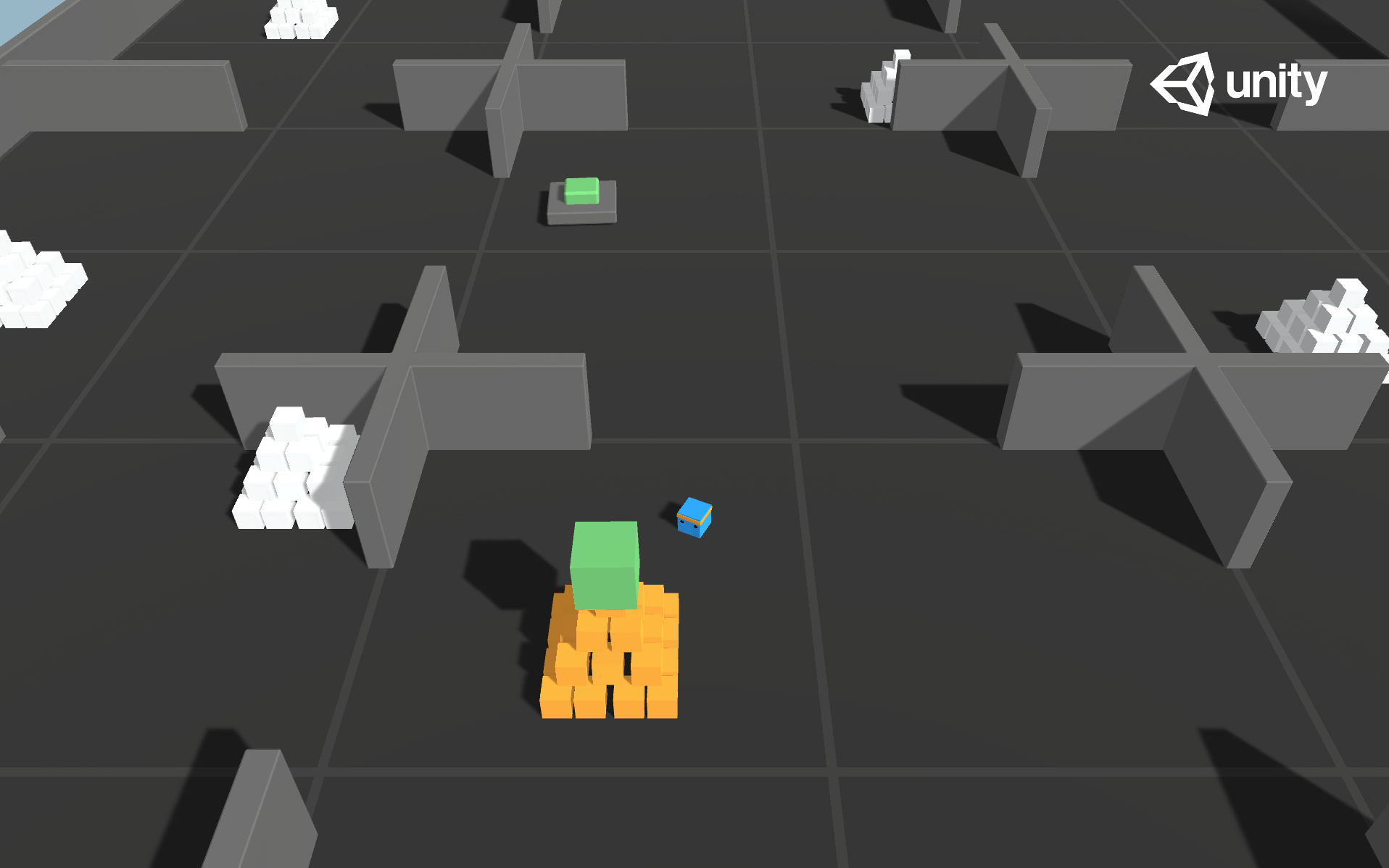 Environment where the agent needs to press a button to spawn a pyramid, then navigate to the pyramid, knock it over, and move to the gold brick at the top.